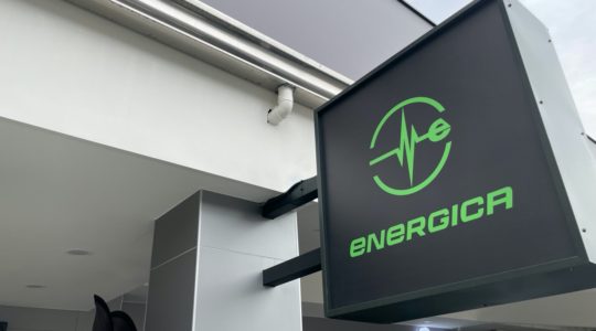 gray sign with green energica logo